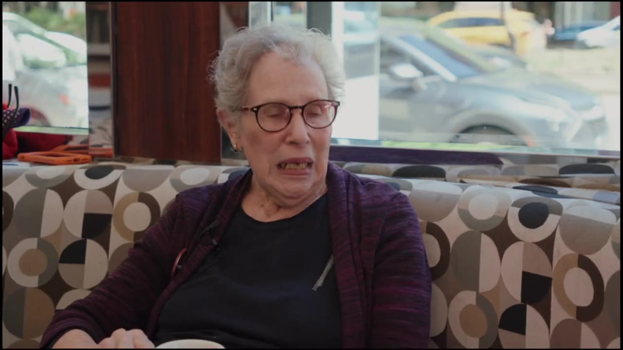 Two neighborhood women in a diner booth, from the Bubbies for Eli video